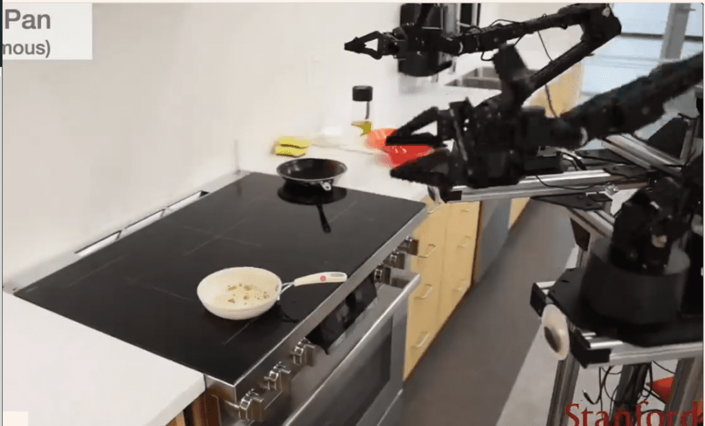 The image shows the real application of Molmo as a Vision Language Action Model where its helps the Robot grippers in interacting with physical items by returning precise coordinates. Kitchen Robots like ALOHA